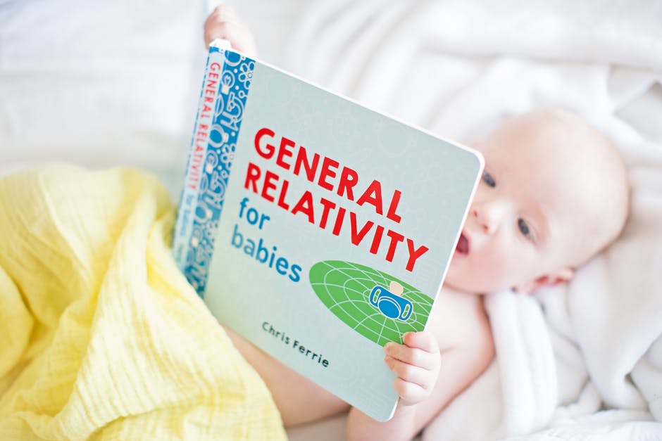 a baby read a book
